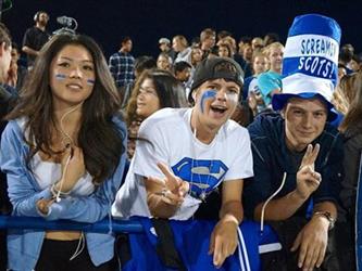 screaming scots in bleachers at a night game