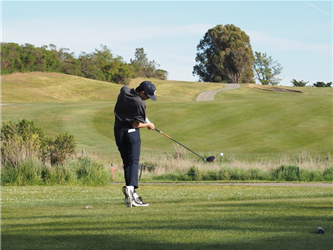 21-22 boys golf swings away