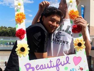Students in "I am beautiful" frame